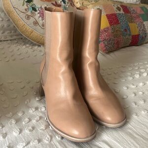 tan pair of mid calf boots.